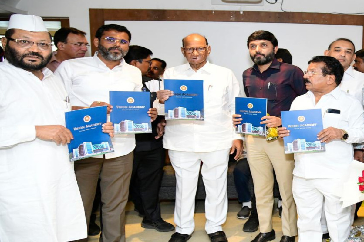 Presentation highlighting 10 years of Vision Academy English Medium School to Shri Sharadchandra Pawar